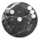 Black marbled game with white and black beads on a white background