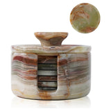 Marble-patterned coaster set with holder on a white background
