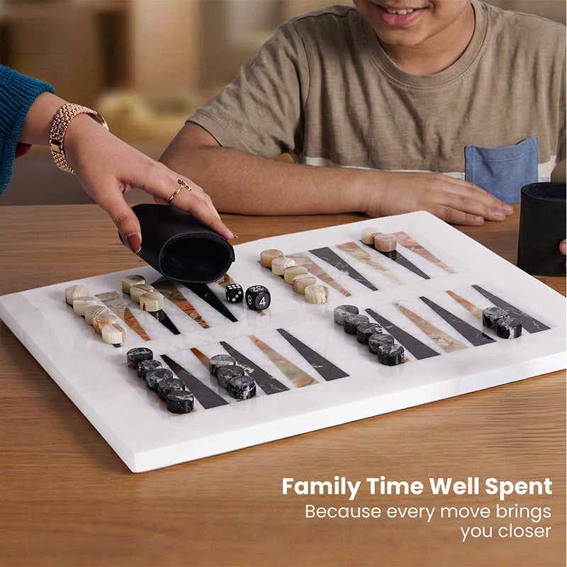 Two children playing a board game with a focus on family time.