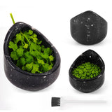  black  herb peeler w shown on a white background. One grinder is open and filled with green herbs, while the other two are closed, one showing the green herbs inside.