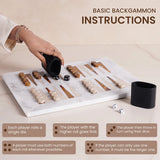 Backgammon board with pieces and dice, hand holding a cup.