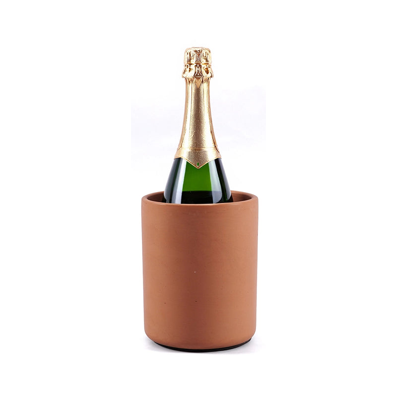 Bottle of champagne in a terracotta wine chiller on a white background