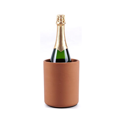 Bottle of champagne in a terracotta wine chiller on a white background