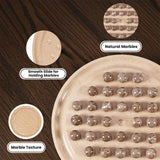 A beige stone game board with oceanic marbles balls arranged on it, shown on a dark wood background with three circular detail callouts labeled 'Natural Marbles,' 'Smooth Slide for Holding Marbles,' and 'Marble Texture.'.