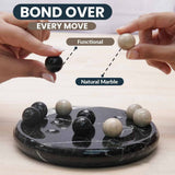 Marble balls on a black marble base with text 'Bond Over Every Move' and 'Functional Natural Marble'.