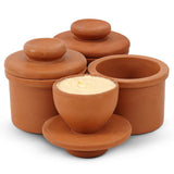 Set of terracotta containers with lids on a white background