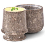 Two marble-textured cups on a white background