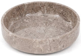 Round stone bowl with natural texture on a white background