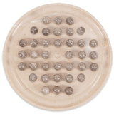 Round stone dish with embedded smaller stones on a white background
