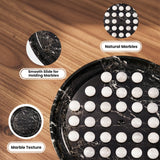 A black marble game board with white marble balls arranged on it, shown on a wood surface with three callout circles highlighting the board's texture, natural marble pattern, and smooth slide for holding chips.