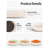 marble bowl with felt bottom and wider opening, featuring text on material and design.