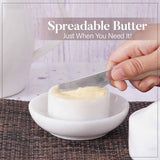 White marble butter crock with spreadable butter being served during breakfast.