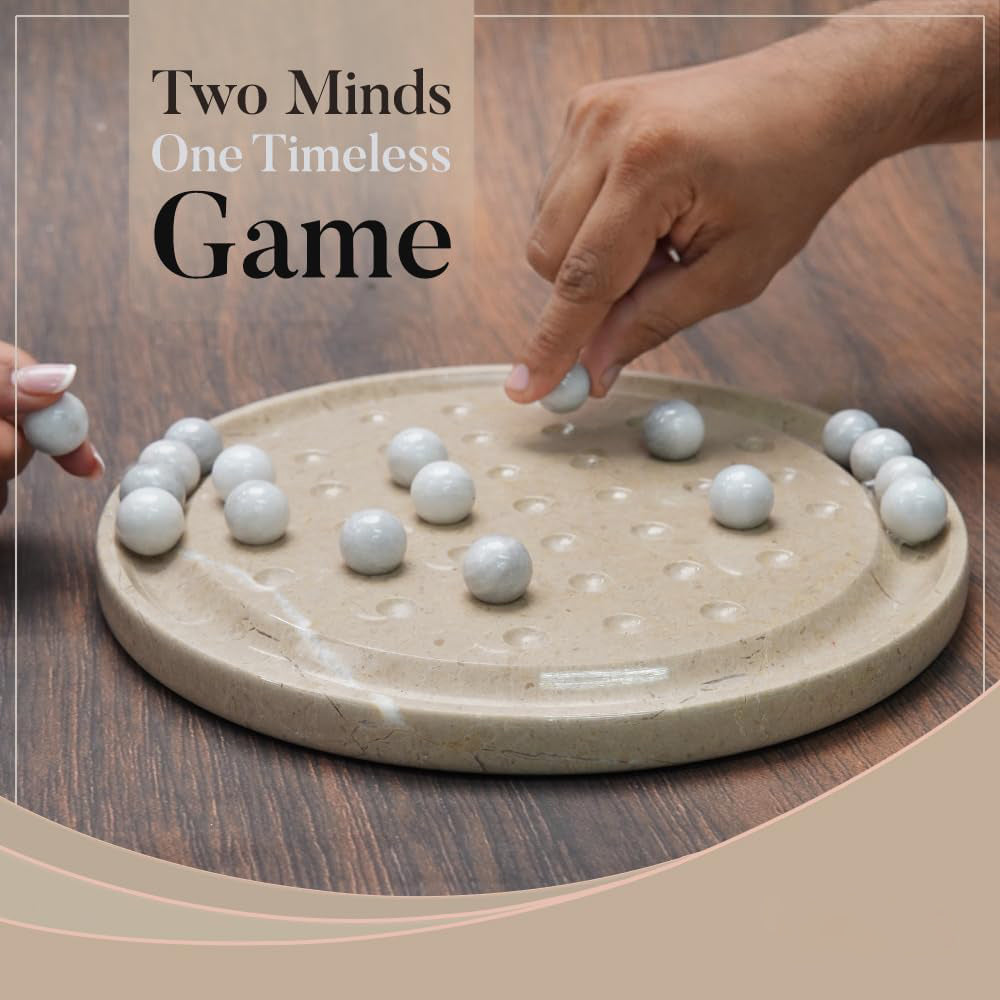 Two hands playing with a traditional game on a wooden table, featuring the text 'Two Minds One Timeless Game'.