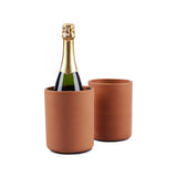 Bottle of champagne in a terracotta cooler with another cooler on a white background