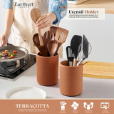 Terracotta utensil holders with wooden and black utensils on a kitchen counter, branded 'Earthen Crafts'.