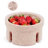 Beige stone bowl filled with strawberries on a white background