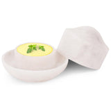 White marble butter crock with lid, showing butter inside on a white background.