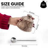 Size guide graphic showing a hand holding a lidded  jar with dimension lines indicating 4 inches in diameter, plus a metal spoon labeled 5 inches, on a white background with text describing capacity as 9.5 oz.