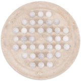 Round beige stone with embedded white balls on a white background