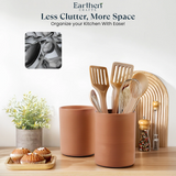 Terracotta kitchen utensil holders with wooden utensils on a wooden surface, featuring Earthen Crafts branding.