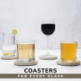 Coasters with glasses of different drinks on a light background