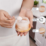 Person holding a marble-patterned glass with a spoon, with product features highlighted.