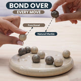 Marble balls on a decorative game with text 'Bond Over Every Move' and 'Functional Natural Marble'.