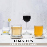 Coasters with glasses of different drinks on a light background