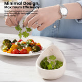 Person preparing a salad with a marble herb peeler on a table.