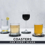 Coasters with glasses of different drinks on a light background