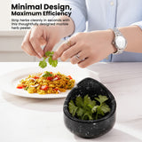 Person using a marble herb peeler to strip herbs from a plate of food.
