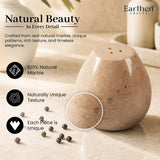 A natural marble pepper shakers by Earthen Crafts