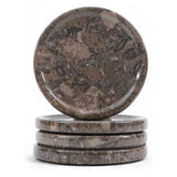 Set of four stone coasters with patterns on a white background