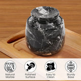 Marble-patterned jar on a wooden surface with product features listed below.