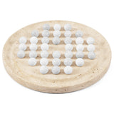 A round travertine stone board holding multiple smooth white spherical balls arranged in rows, photographed on a clean white background.