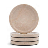 Set of two beige stone coasters on a white background