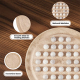 A tarvertine board with multiple small white marbles arranged in rows, shown on a dark wood surface with three circular callout insets labeled Smooth Slide for Holding Marbles, Natural Marbles, and Travertine Stone.