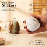 Two decorative salt and pepper shakers