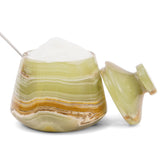 Decorative stone container with a lid on a white background