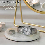 Silver watch and ring on a white coaster with 'Chic Catch' branding.