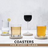 Coasters with glasses of different drinks on a light surface