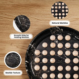 A black marble tray with round beige marble balls arranged on it, shown on a wood surface with three callout circles labeled Natural Marbles, Smooth Slide for Holding Marbles, and Marble Texture.
