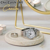 Silver watch on a coaster with 'Chic Catch