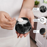 Person holding a black marble bowl with a spoon, surrounded by product features.