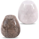 Two stones, one with natural patterns and the other smooth and white, on a white background.
