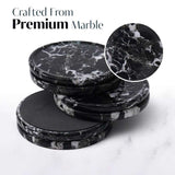 Stack of black marble coasters with a close-up detail on a white background.