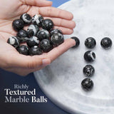 Hand holding black and white marble balls with more balls on a marble surface, text 'Richly Textured Marble Balls'.