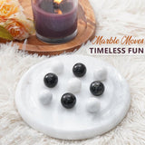 Marble moves on a white surface with text 'Marble Moves Timeless Fun'.