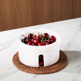 Marble berry bowl styled on kitchen countertop with fresh berries