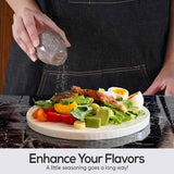 Person seasoning a salad with a stone, with text 'Enhance Your Flavors' at the bottom.